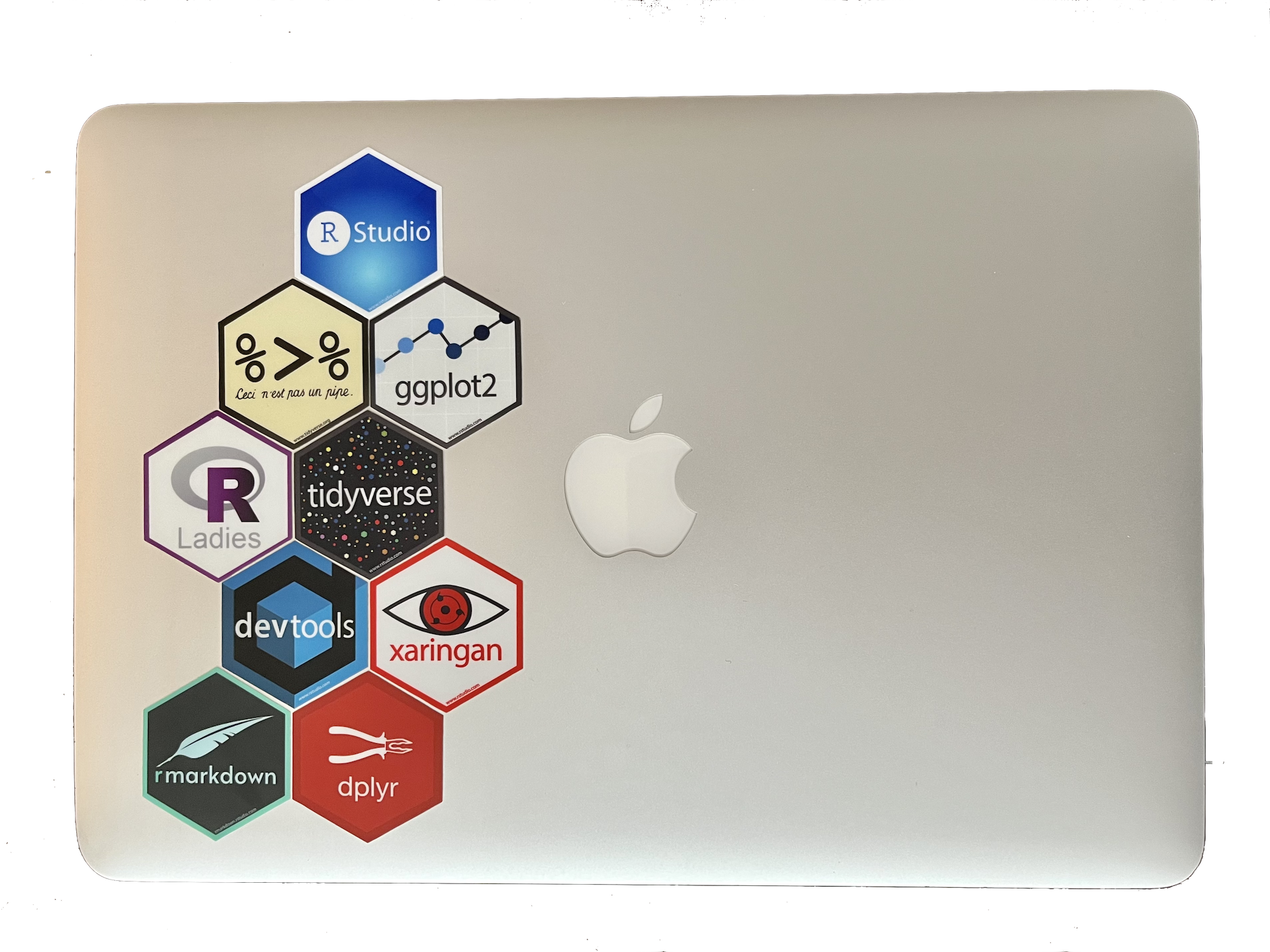 A Mac laptop with R stickers on it